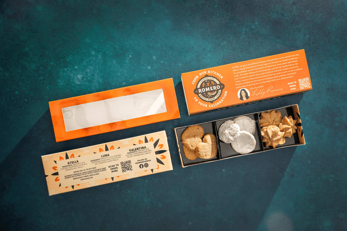 orange romero macaron style mexican cookie favor box in 4 parts against green background