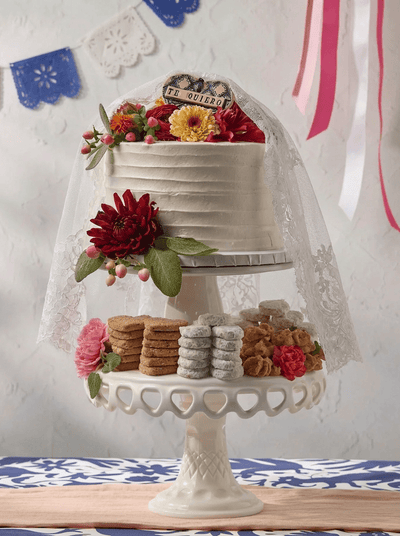 wedding cake and mexican wedding cookies ready for a mexican wedding celebration