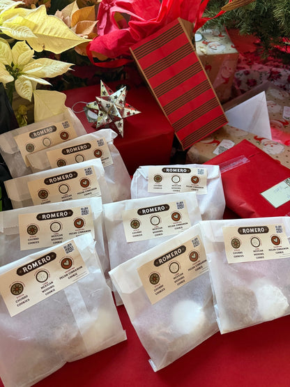 cookies in wax paper bags with poinsettia background