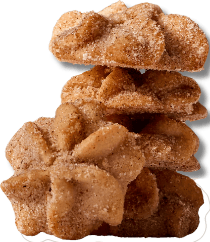 Stack of Stella flower-shaped mexican churro cookies coated in cinnamon sugar, traditional churro flavor