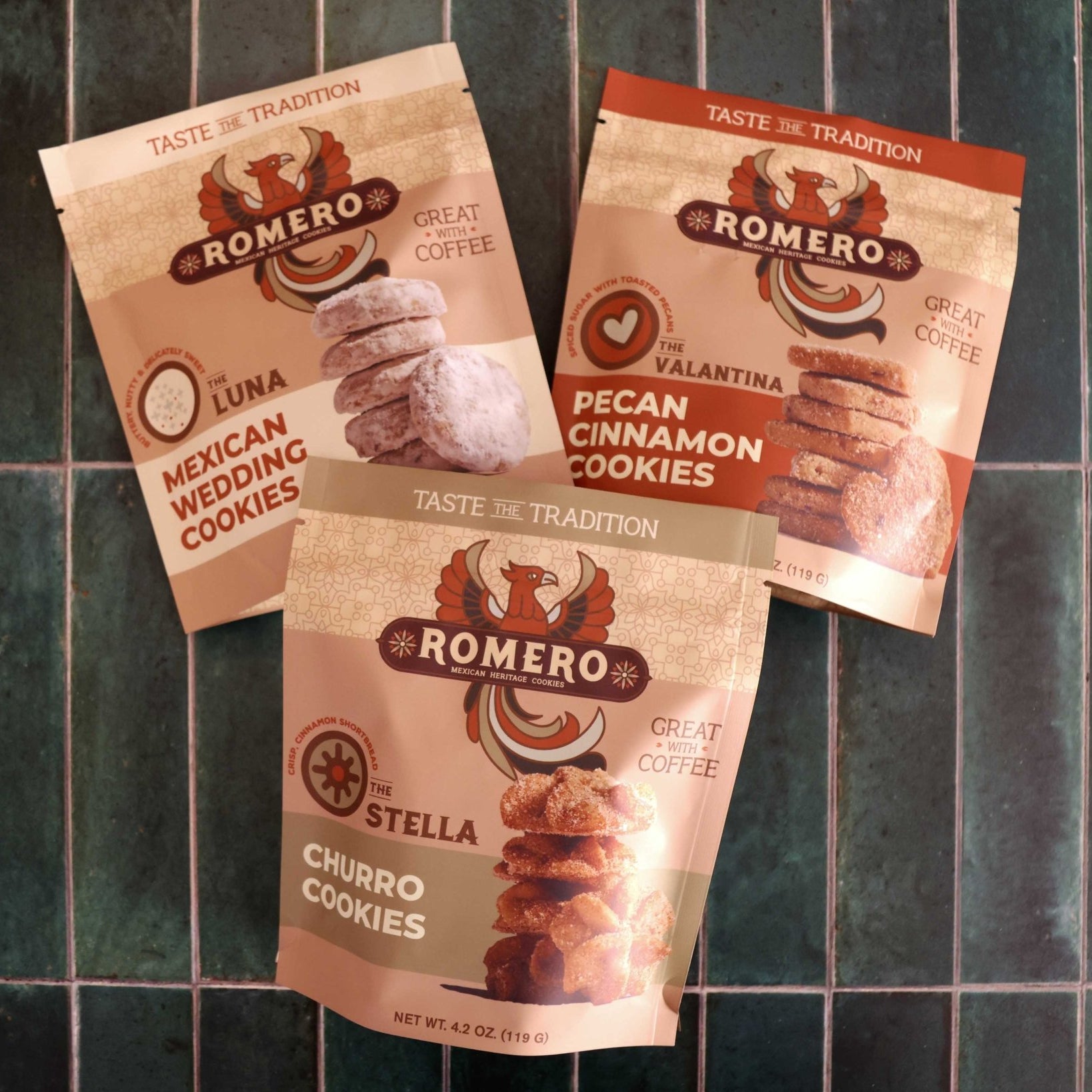three bags of mexican cookies on green tile background