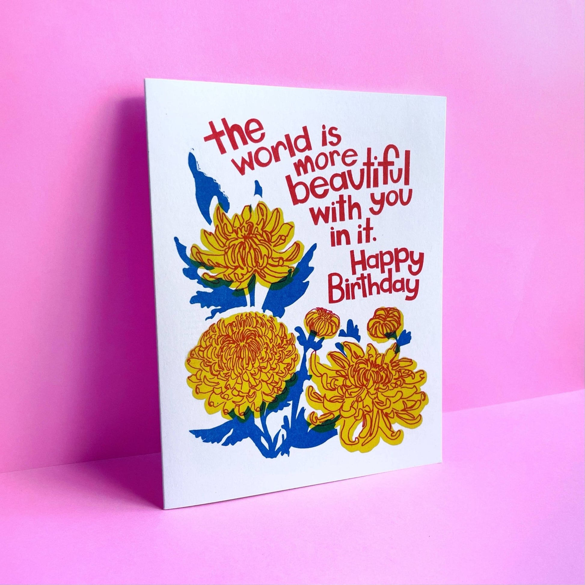Greeting card with floral design and birthday message on a pink background