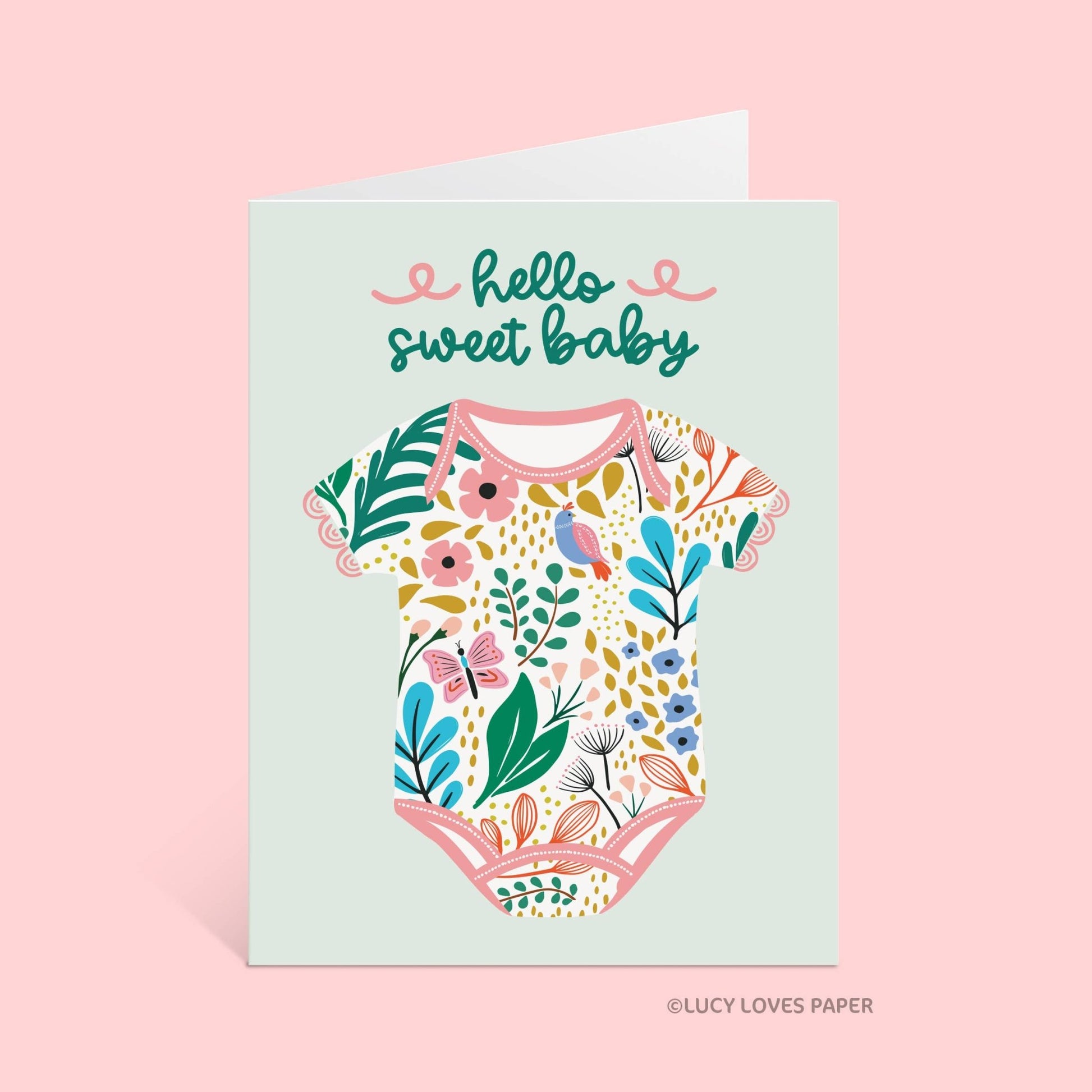 Greeting card with floral baby onesie design and 'hello sweet baby' text on a light blue background.