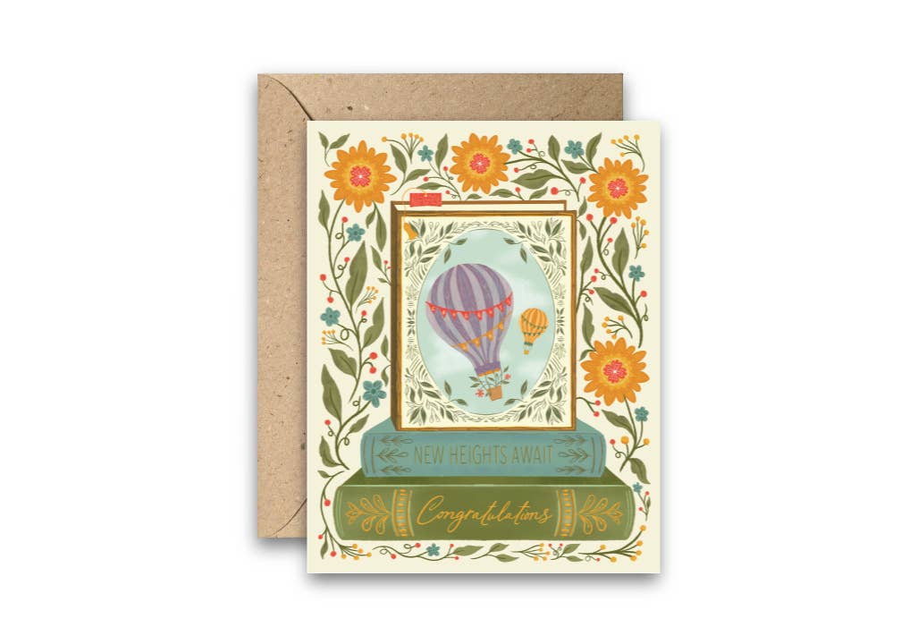 Greeting card with hot air balloon design and floral elements on a white background