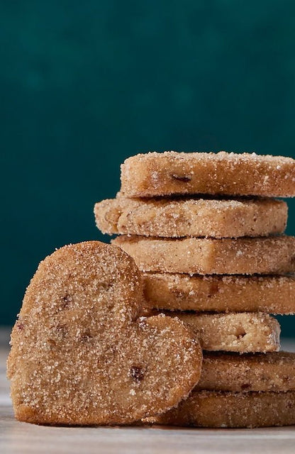 Valentina mexican pecan cinnamon cookies on dark plate, heritage polvorón-style shortbread cookies