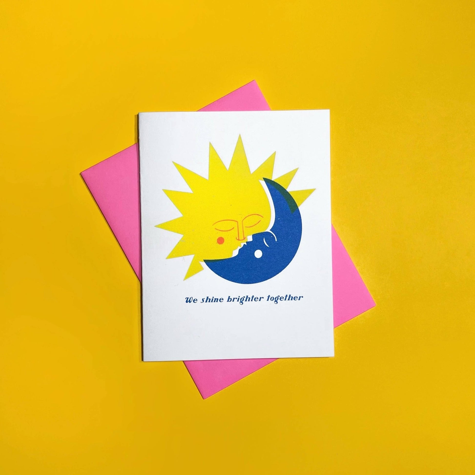 Card with sun and moon design on a yellow background