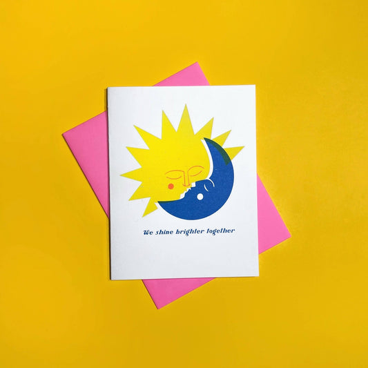 Card with sun and moon design on a yellow background